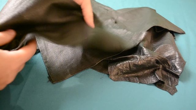 Black geniune leather. Throwing pieces of leather