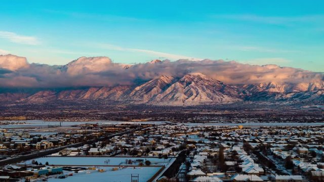 Wasatch mountains timelapse of clouds swirling around during sunset