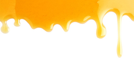 Fresh sweet honey flowing on white background