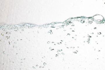 Closeup bubbles underwater on white background.