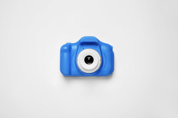 Toy camera isolated on white, top view. Classic blue - color of the Year 2020