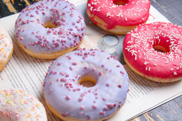 Sweet tasty donuts on table