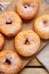 Sweet tasty donuts on table