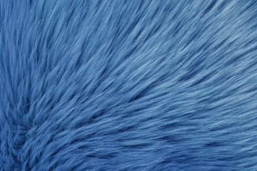 Faux fur as background, top view. Color of the year 2020 (Classic blue)