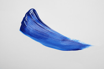 Paint stroke on white background background, top view. Color of the year 2020 (Classic blue)