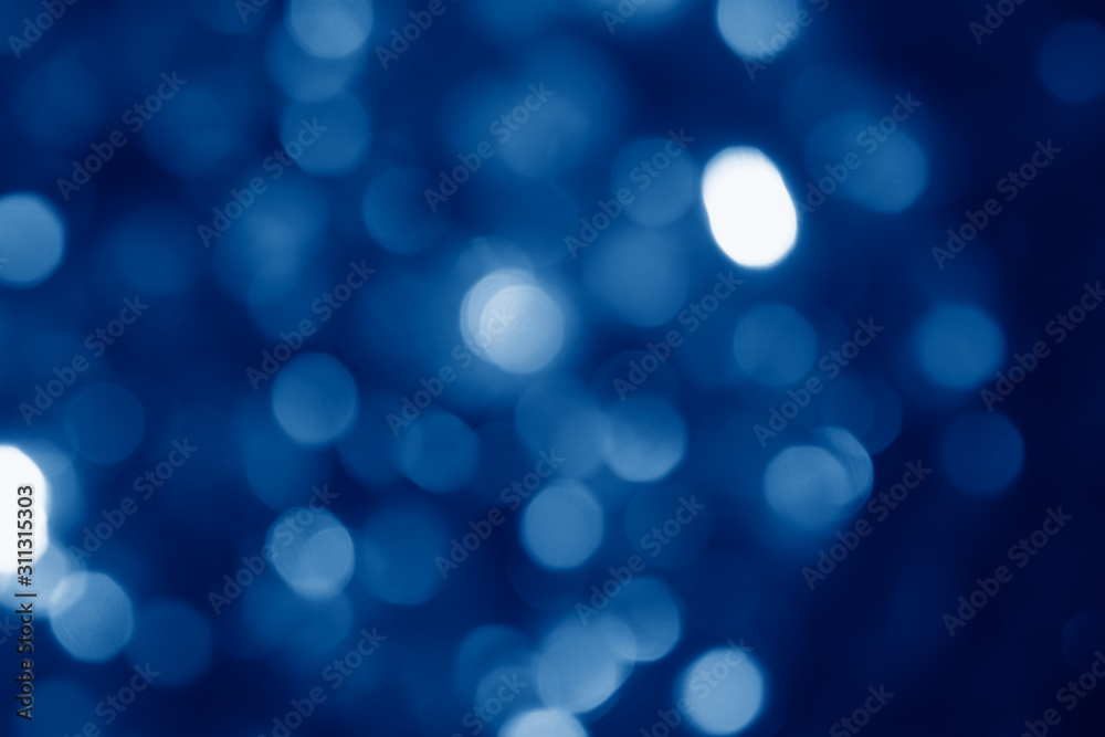 Poster abstract blurred circular bokeh lights background toned in trendy classic blue color of the year 202