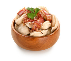Bowl with tasty dumplings on white background
