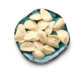 Plate with tasty dumplings on white background