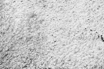 Texture of a concrete wall with cracks and scratches which can be used as a background