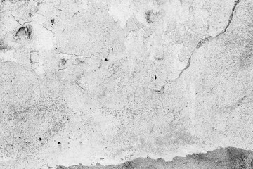 Texture of a concrete wall with cracks and scratches which can be used as a background