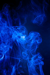 Blue smoke motion on black background.