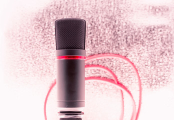 Sound studio. Microphone with cable isolated on bright  background