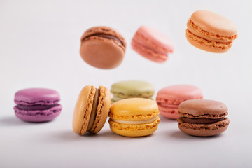 delicious colorful macaroons on gray background