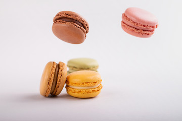 delicious colorful macaroons on gray background