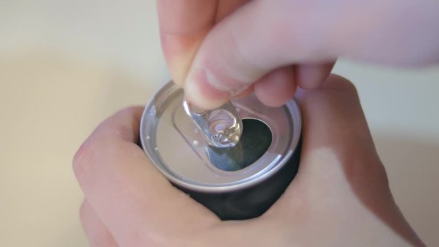 Grabbing and opening a soda can