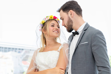 Sweet time.Bride and groom couple of Caucasian hug in wedding studio.