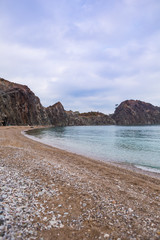 Calm sea and cliffs.