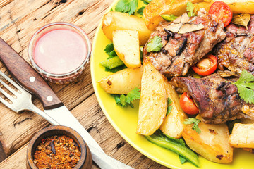 Grilled meat and potatoes