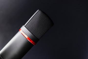 Sound studio. Microphone with cable isolated on black background