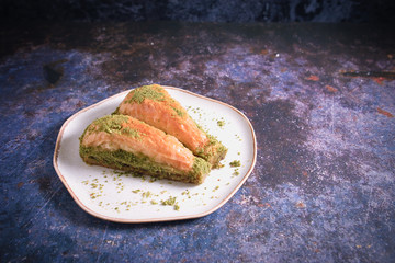 Pistachio Turkish Baklava  Havuc Dilimi. Traditional Turkish Dessert. Walnut, Pistachio Turkish Style Antep Baklava. Baklava from Turkish cuisine. Top View Photo.