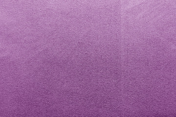 Plastic glittering texture in purple color.