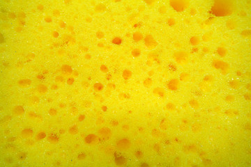 Yellow color cleaning sponge  surface close up.