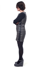 Fototapeta premium middle-aged woman with a dress on white background, profile arms crossed