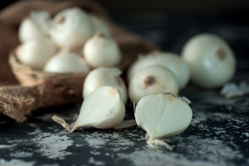 Onions on textured background. Food Ingredients.