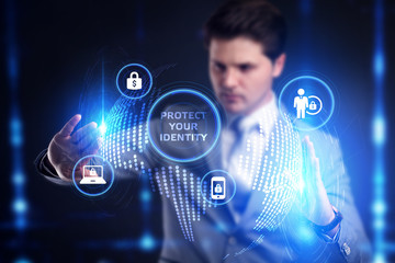 Business, technology, internet and networking concept. Young businessman working select the icon Protect your identity  on the virtual display.