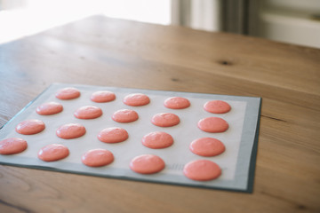 Obraz na płótnie Canvas Macaroons ready for baking lie on a silicone baking mat