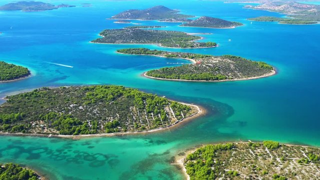 Emerald and turquoise blue sea, many small green islands in Murter archipelago from air, Dalmatia, Croatia. Seascape paradise, drone reveal footage.