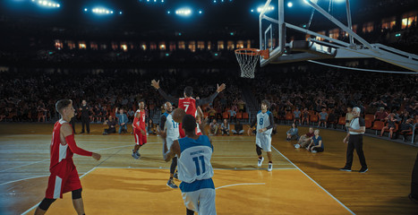 Fototapeta premium Basketball players on big professional arena during the game. Tense moment of the game. Celebration