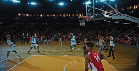 Fototapeta premium Basketball players on big professional arena during the game. Tense moment of the game. Celebration