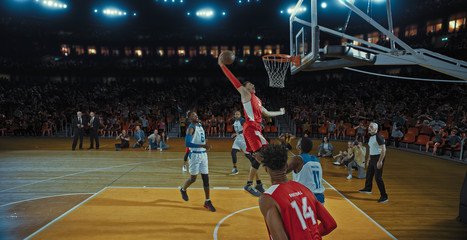 Fototapeta premium Basketball players on big professional arena during the game. Tense moment of the game. Celebration
