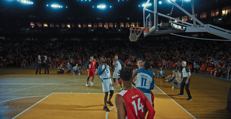 Fototapeta premium Basketball players on big professional arena during the game. Tense moment of the game. Celebration