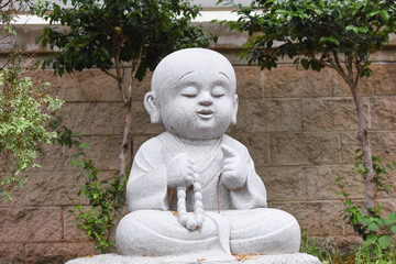 A Buddhist boy monk statue
