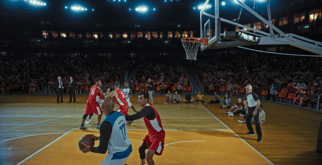 Fototapeta premium Basketball players on big professional arena during the game. Tense moment of the game. Celebration
