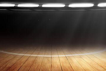 Close up view of a basketball court with wooden floor and spotlights