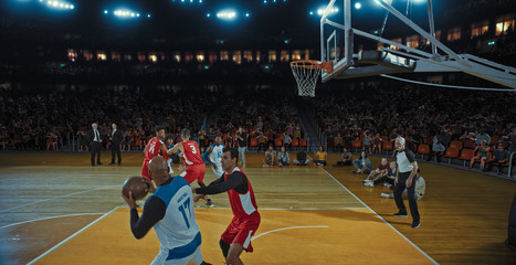 Obraz premium Basketball players on big professional arena during the game. Tense moment of the game. Celebration