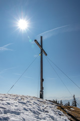 View on Summit Cross of Jochberg, 1565 m in Winter. Located in Bavarian Prealps near Kochel am See, Upper Bavaria, Germany