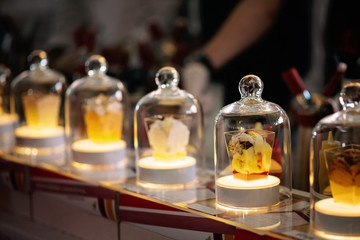 Obraz na płótnie Canvas A spectacular presentation of molecular cuisine in a glass flask with backlight.