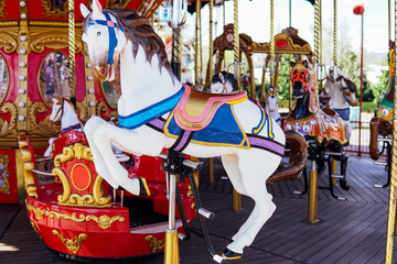 Fototapeta na wymiar Kid attractions colorful carousel horse fun x