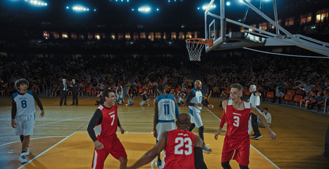 Fototapeta premium Basketball players on big professional arena during the game. Tense moment of the game. Celebration