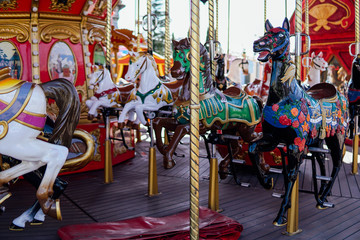 Fototapeta na wymiar Kid attractions colorful carousel horse fun z