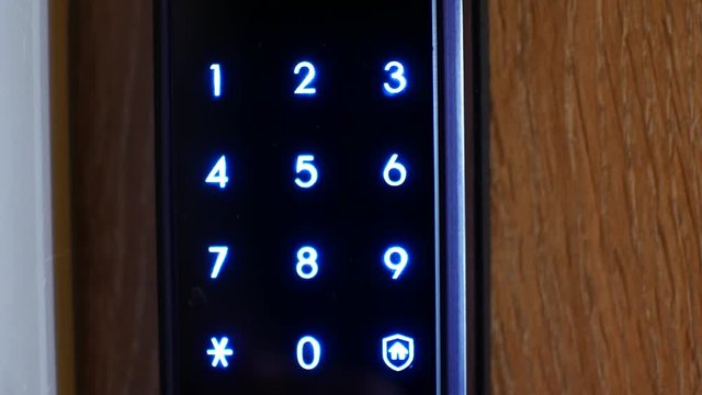 Digital combination lock on the door. Entrance to the apartment in the condominium
