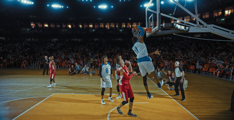 Obraz premium Basketball players on big professional arena during the game. Tense moment of the game. Celebration