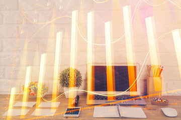 Forex market graph hologram and personal computer on background. Double exposure. Concept of investment.