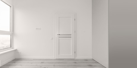 White room with a white door