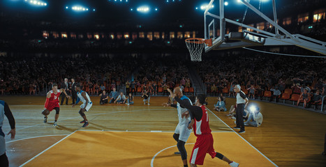 Fototapeta premium Basketball players on big professional arena during the game. Tense moment of the game. Celebration