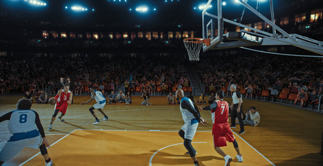 Fototapeta premium Basketball players on big professional arena during the game. Tense moment of the game. Celebration